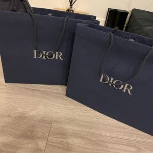 Two men dior bags